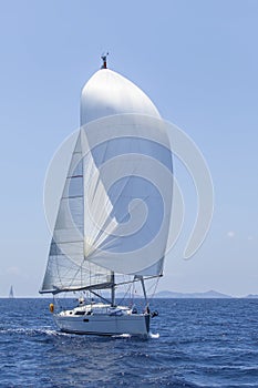 Ship yachts with white sails in the open Sea. Luxury Lifestyle.