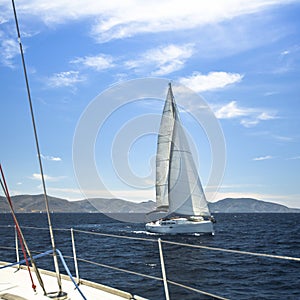 Ship yachts with white sails in the open Sea. Sailing.