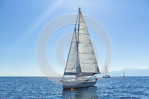 Ship yachts with white sails in the open Sea. Sailing.