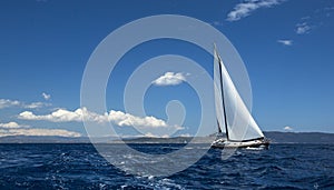 Ship yachts with white sails in the open Sea. Sailing luxury boats. Travel.