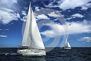 Ship yachts with white sails in the open sea. Sailing. Yachting