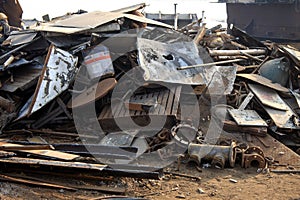 Shipbreaking Yard in Darukhana, Mumbai, India Ã¢â¬â INS Vikrant dismantling with scrap metal & workers in background photo