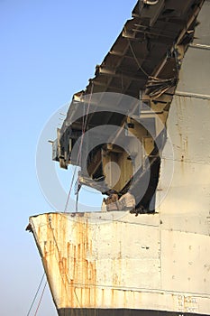 Shipbreaking Yard in Darukhana, Mumbai, India â€“ INS Vikrant dismantling with scrap metal & workers in background