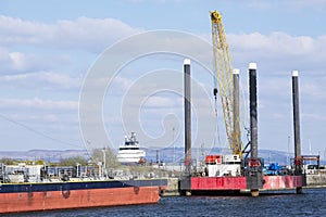 Shipbuilding crane construction large ship vessel at dock port