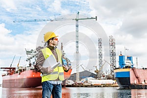 Shipbuilding engineer at the dock side in a port.