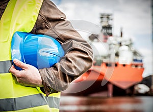 Shipbuilding engineer with safety helmet in shipyard