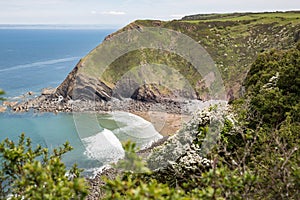 Shipload Bay on Devon`s coast with waves rolling in