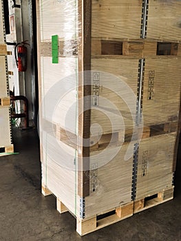 Shipment cartons box on pallets and wooden case on forklift in interior warehouse cargo for export and sorting goods in freight