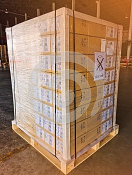 Shipment cartons box on pallets and wooden case on forklift in interior warehouse cargo for export and sorting goods in freight