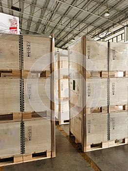 Shipment cartons box on pallets and wooden case on hand lift in interior warehouse cargo for export and sorting goods in freight l