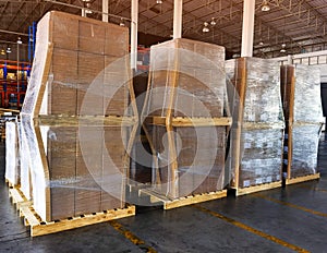 Shipment cartons box on pallets and wooden case on hand lift in interior warehouse cargo for export and sorting goods in freight l