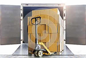 Shipment goods, Cargo freight truck, Delivery. Hand pallet jack with stack cardboard boxes on pallet loading into container truck.