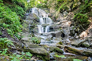 Shipot waterfall on a mountain river among stones and rocks in the Ukrainian Carpathians