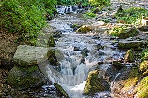 Shipot waterfall on a mountain river among stones and rocks in the Ukrainian Carpathians