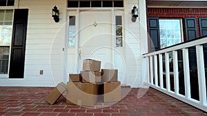 Shipping boxes near beautiful front door