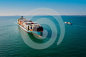 Shipping cargo containers businesses services import and export international transportation open sea landscape aerial view blue s