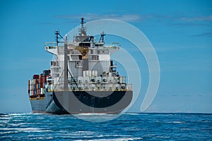 Shipping container on a Blue ocean with Blue Skies