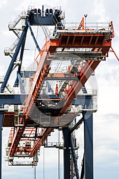 Shipping container gantry crane in an industrial port