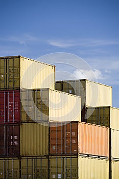 Shipping containers against blue sky