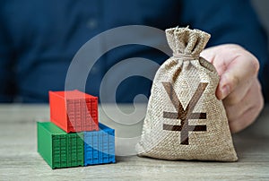 Shipping containers and chinese yuan or japanese yen money bag.