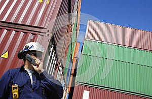 Shipping containers and dock worker photo