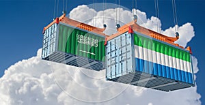 Shipping containers with Sierra Leone and Saudi Arabia national flags.