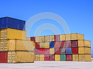 Shipping Containers stacked at a holding platform.