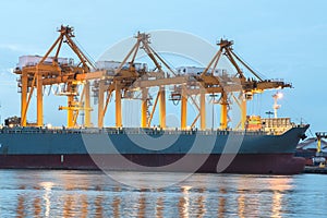 Shipping port with crane for container uploading photo