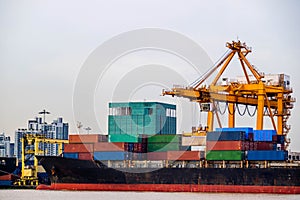 Shipping trade port. Container cargo ship loading or unloading by crane