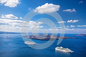 Ships against caldera on Santorini island in Greece