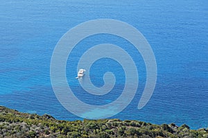 Ships anchored off the coast on the blue calm sea