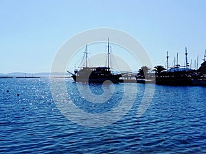 Ships anchored in port of Neos Marmaras photo