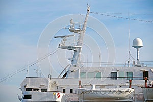 Ships antenna and navigation system on background sky