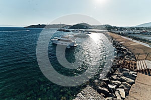 Ships on blue water sea ocean of the harbour in bodrum. Watch from the castle wide angle evening sun. Warm hot summer