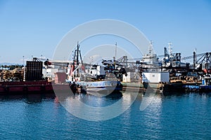 Ships and boats anchored in old port of Drapetsona Piraeus Greece, sunny day