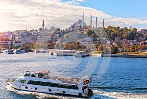 Ships in the Bosphorus, Eminonu pier and the Suleymaniye Mosque, Istanbul photo