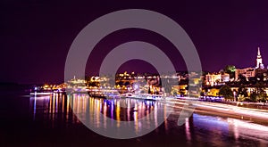 Ships dock on Sava river and city centre of Belgrade with Kalemegdan and Saborna church