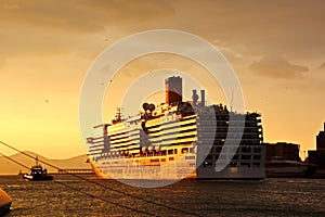 SHIPS AND FERRY AT THE PARKING PORT AT THE SUNSET.