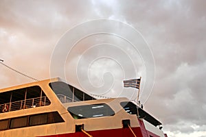 SHIPS AND FERRY AT THE PARKING PORT AT THE SUNSET.