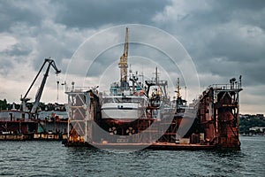 Ships in floating dry dock under repair