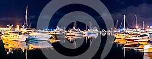 Ships in the harbor under the night starry sky. Black Sea, Sochi, Europe