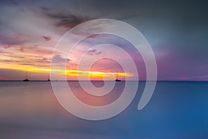 Ships at peaceful sunset on Caribbean sea of Aruba, Dutch Antilles