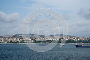 Ships sailing on Bosporus strait which connected Black sea and sea of Marmara with Istanbul Asia side shore and mountain