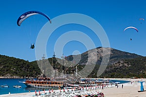 Ships and paragliding Mountains and sea