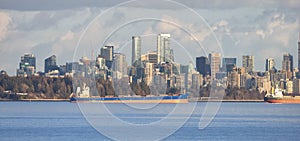Ships and Vancouver Downtown Skyline on West Coast of Pacific Ocean. BC, Canada