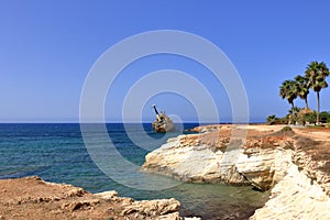 Shipwreck of the abandoned ship Edro III on a rocky coast at Akrotiri Beach in Cyprus