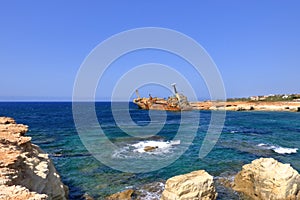 Shipwreck of the abandoned ship Edro III on a rocky coast at Akrotiri Beach in Cyprus