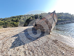 shipwreck on the beach of agalypa of skyros in greece pine trees clear transparent water in the sea