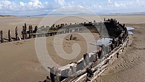 Shipwreck on the Cefn Sands beach at Pembrey Country Park in Carmarthenshire South Wales