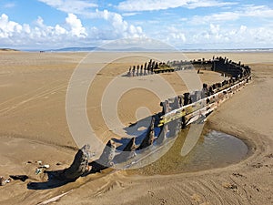 Shipwreck on the Cefn Sands beach at Pembrey Country Park in Carmarthenshire South Wales UK